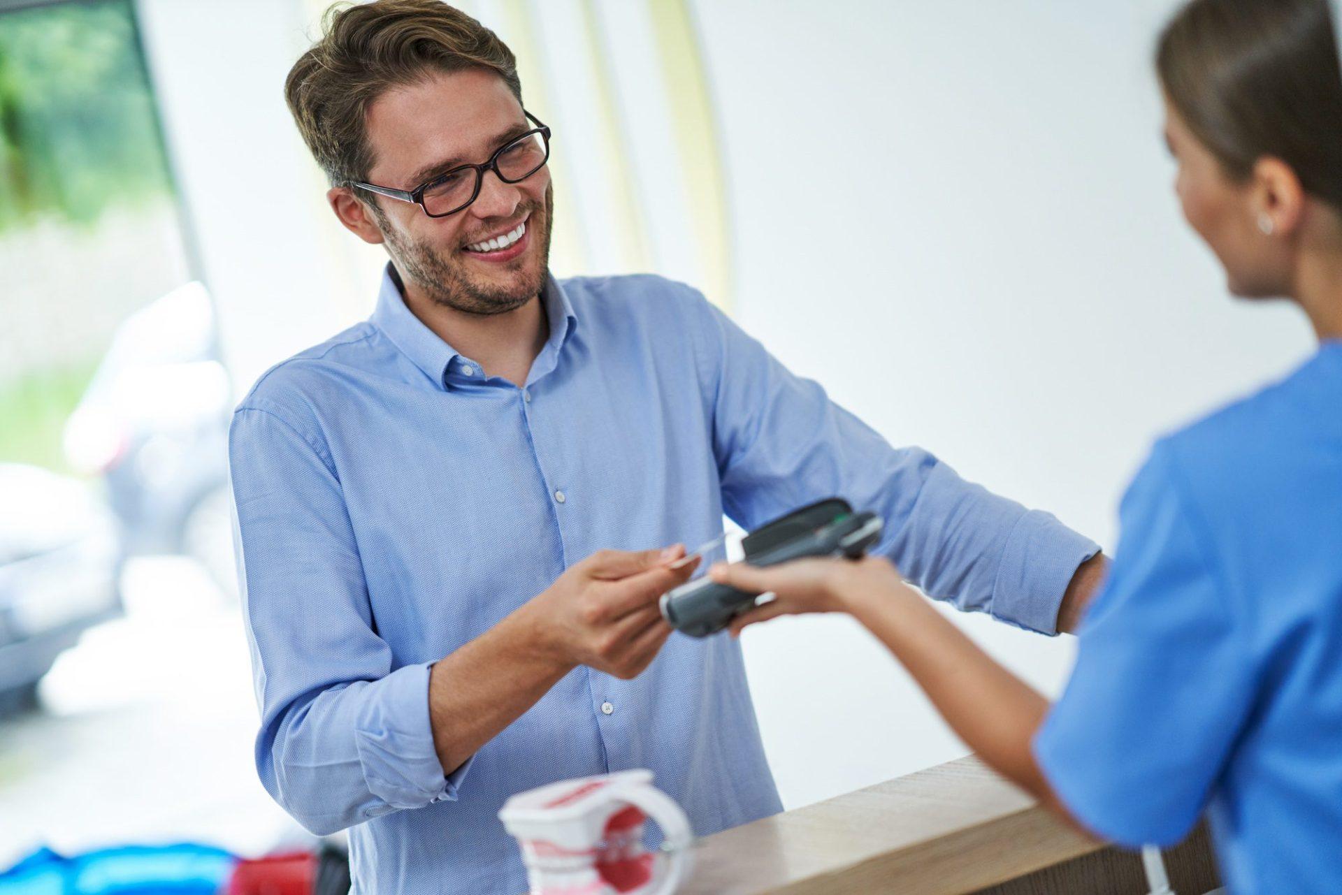 patient paying for dental visit in clinic 1