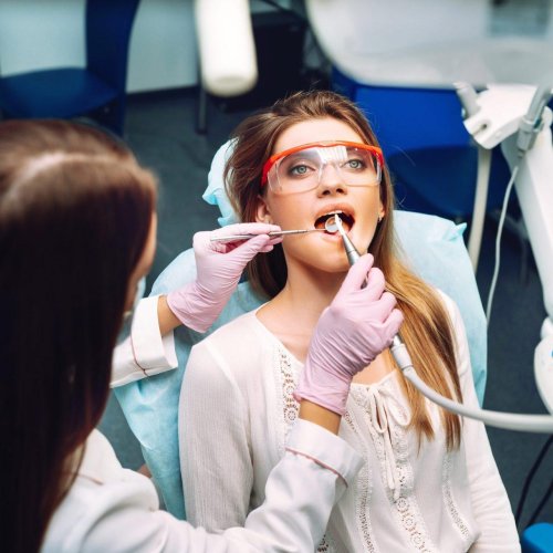 young woman at the dentist s chair during a dental procedure overview of dental caries prevention r8e7hftp22bzhci2jvri6q7abbmykjpa9b6hqcngqw