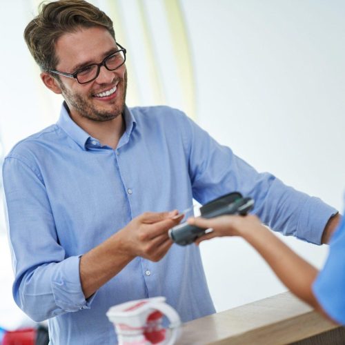 patient paying for dental visit in clinic 1